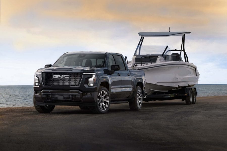 2027 GMC Sierra Denali Ultimate towing a boat with the new 6.6-litre V8 engine